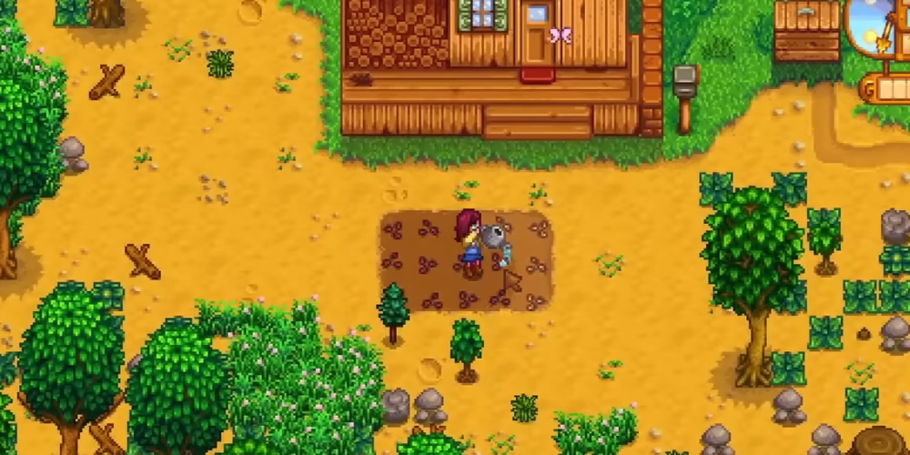 Player character watering freshly planted parsnip seeds on Day 1 in Stardew Valley farm near the starting farmhouse.