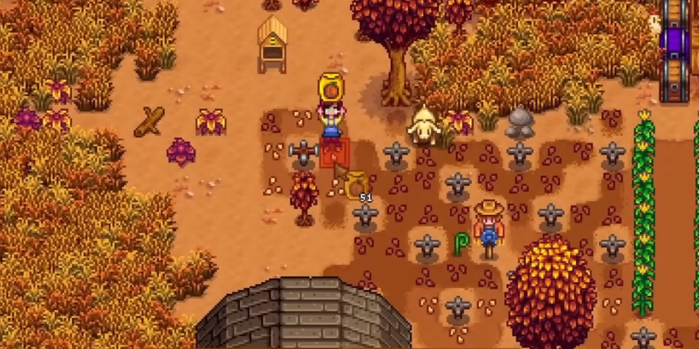 Fall farm layout in Stardew Valley featuring pumpkin fields, sprinklers, and seasonal crops planted for high profit and Community Center completion.